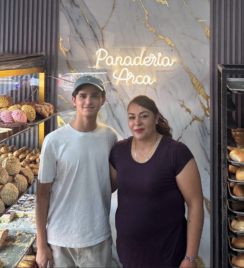 Vicente with a customer at Panadería Arca