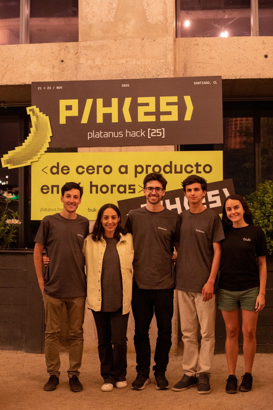 The staff at night in front of the P/H(25) banner