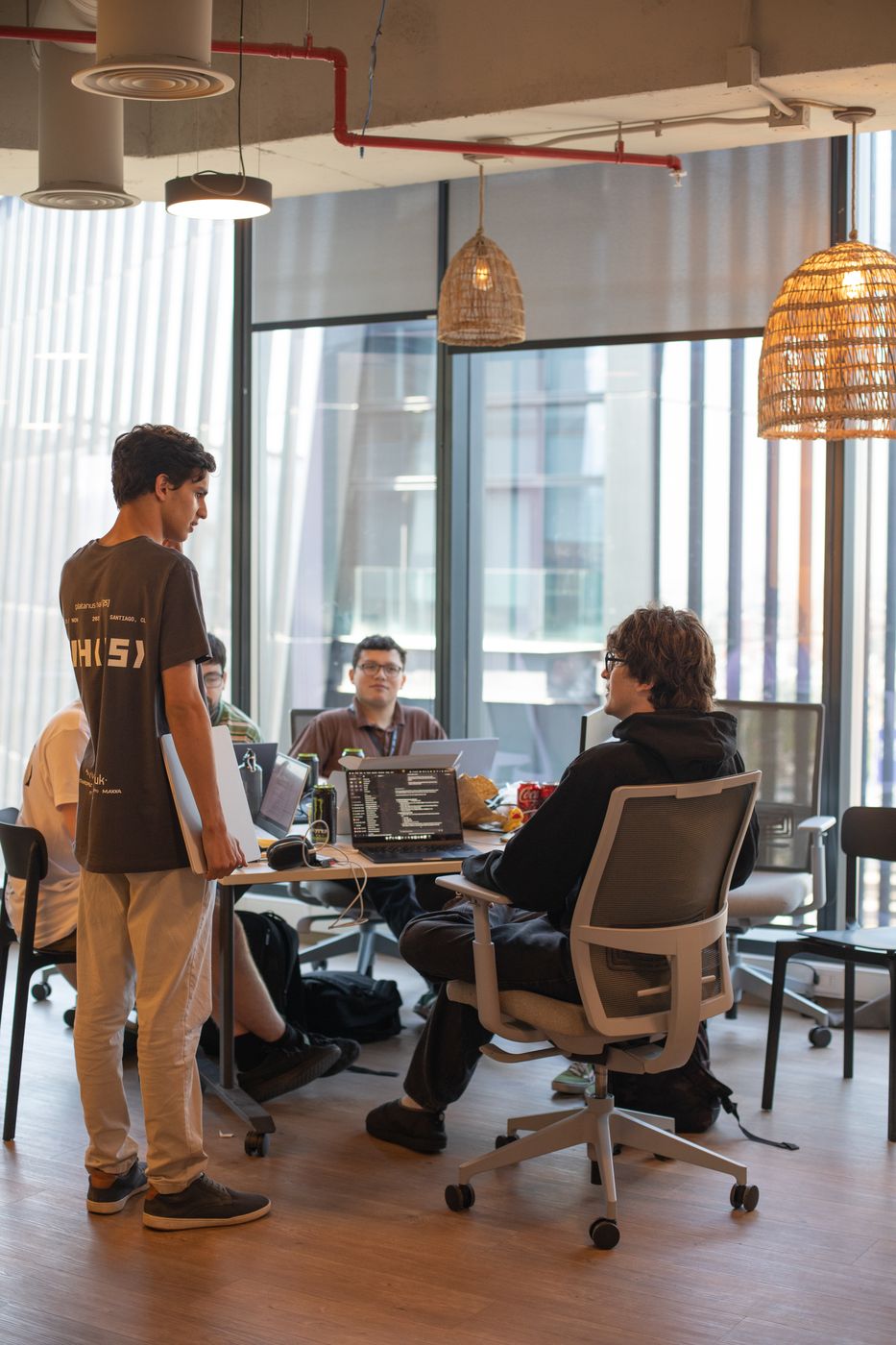 Hackers building at their tables
